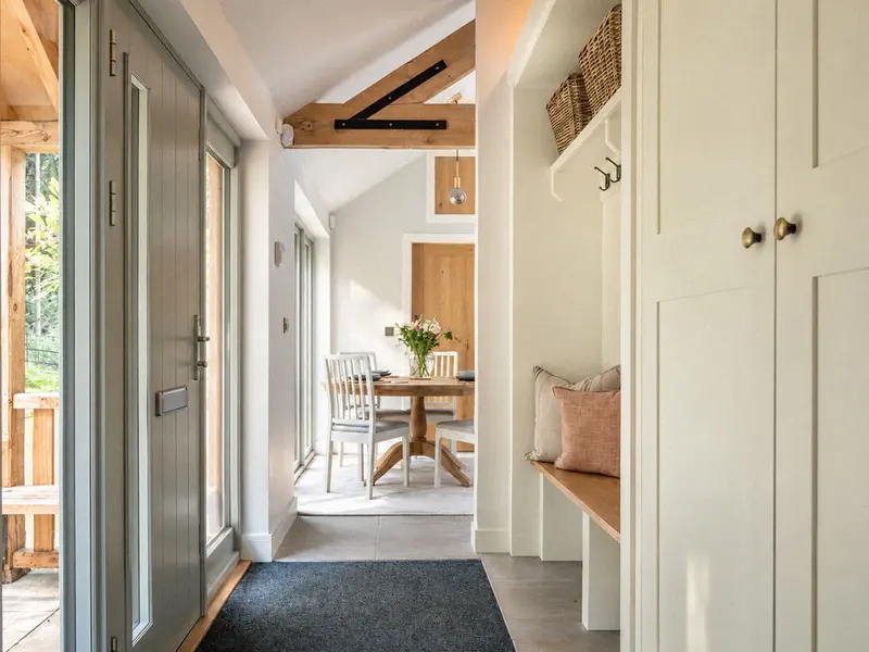 The entrance hall opening into the bright dining area