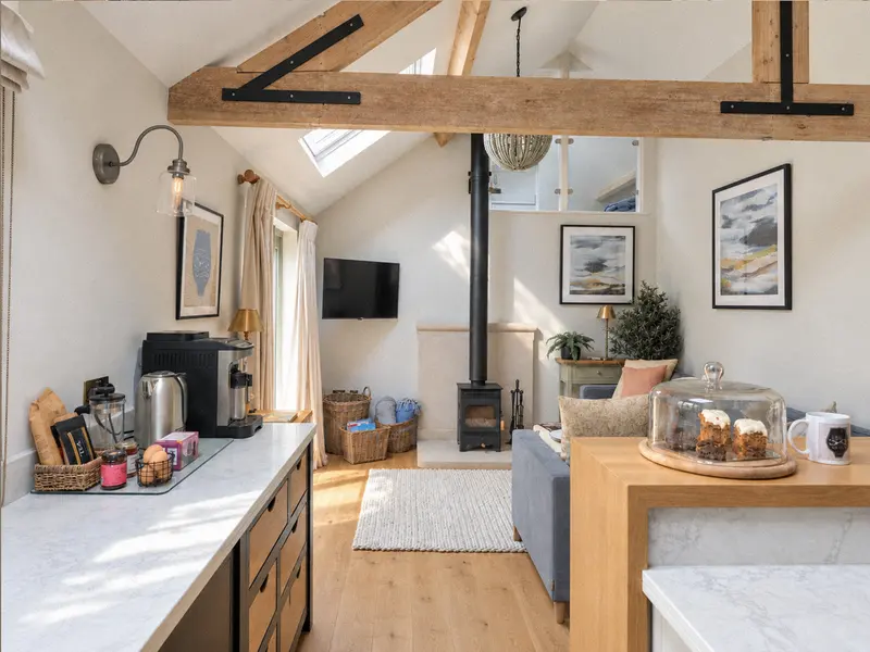 Kitchen worktop overlooking the living space and exposed beams