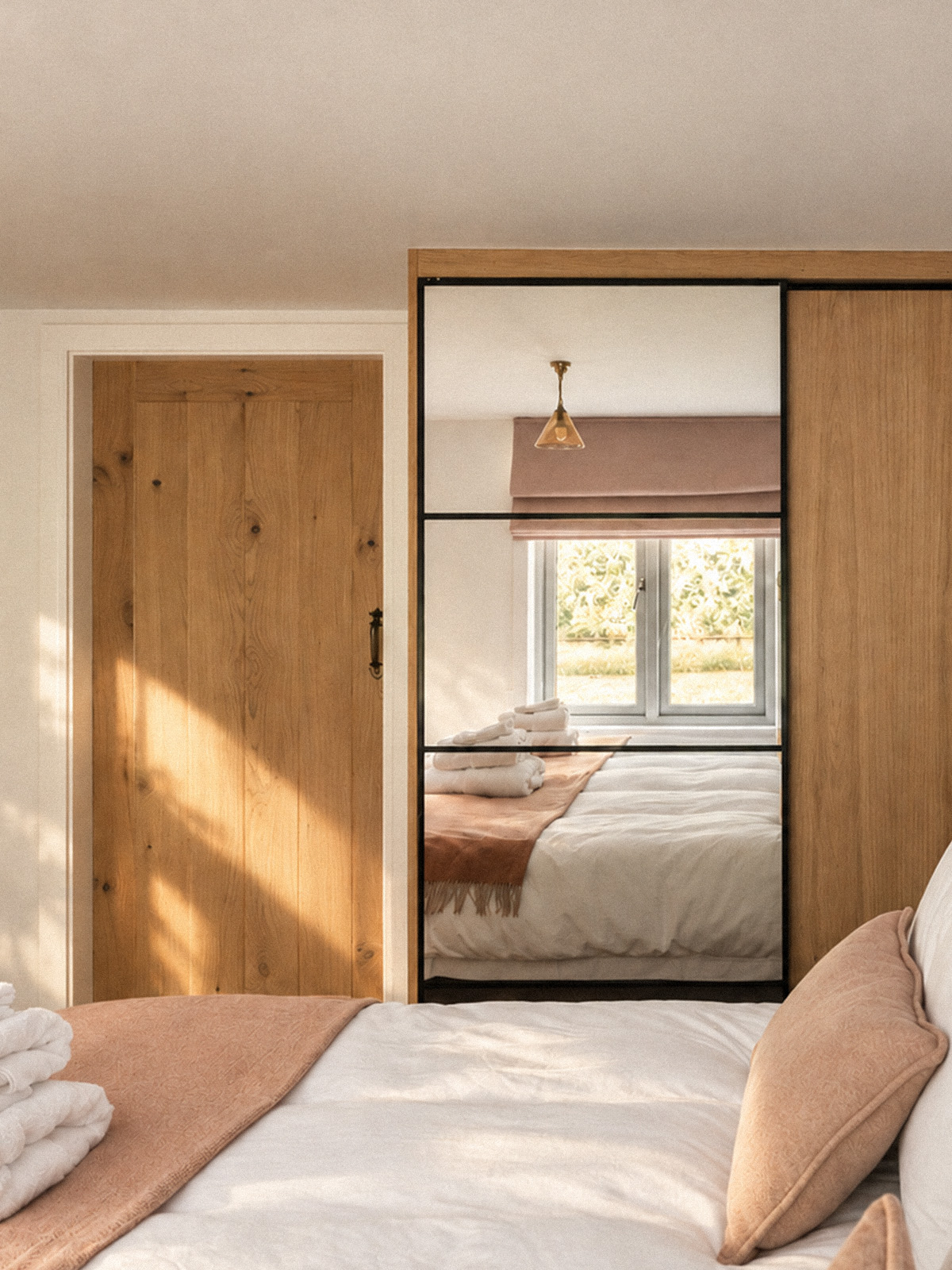 The west bedroom, reflected in its wardrobe mirror