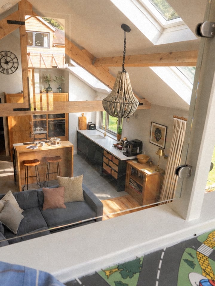 The workshop seen from the upstairs playroom, with its original road-pattern floor